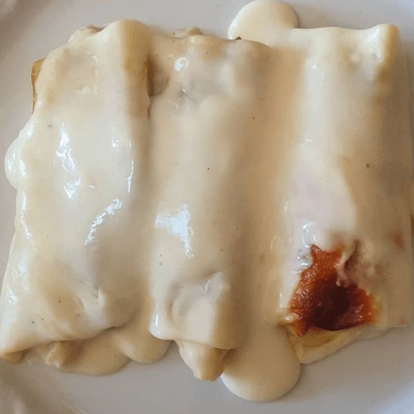 Canelones de alcachofas y langostinos imagen destacada